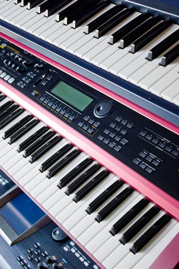 music keyboards on a rack